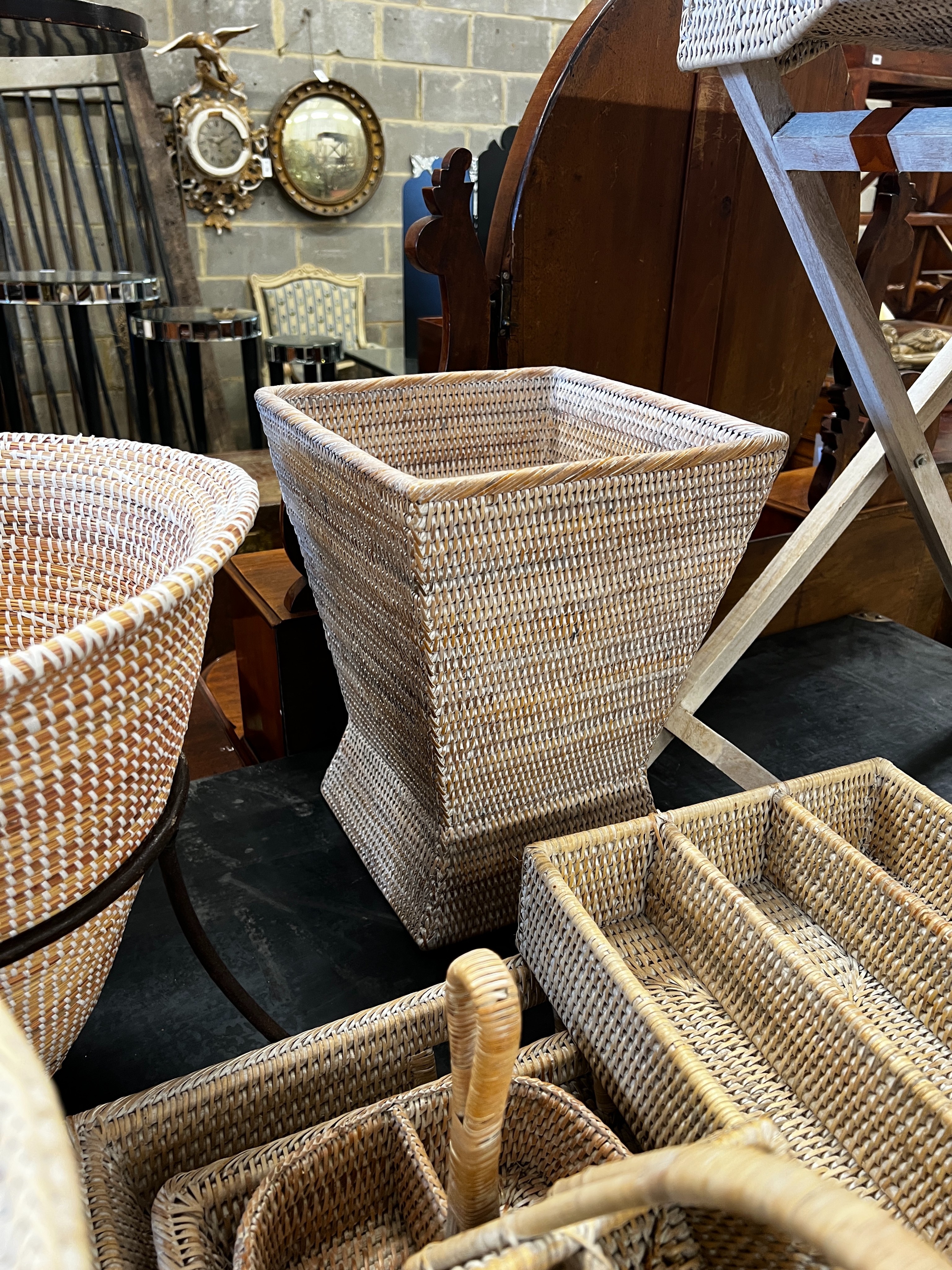 A wicker tray on folding stand together with nine other pieces of wickerwork